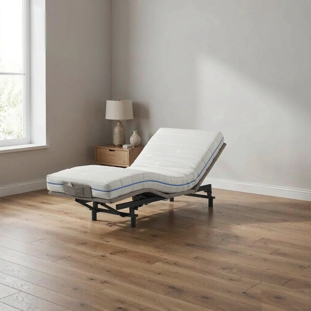 Adjustable bed base with white mattress in a bright bedroom